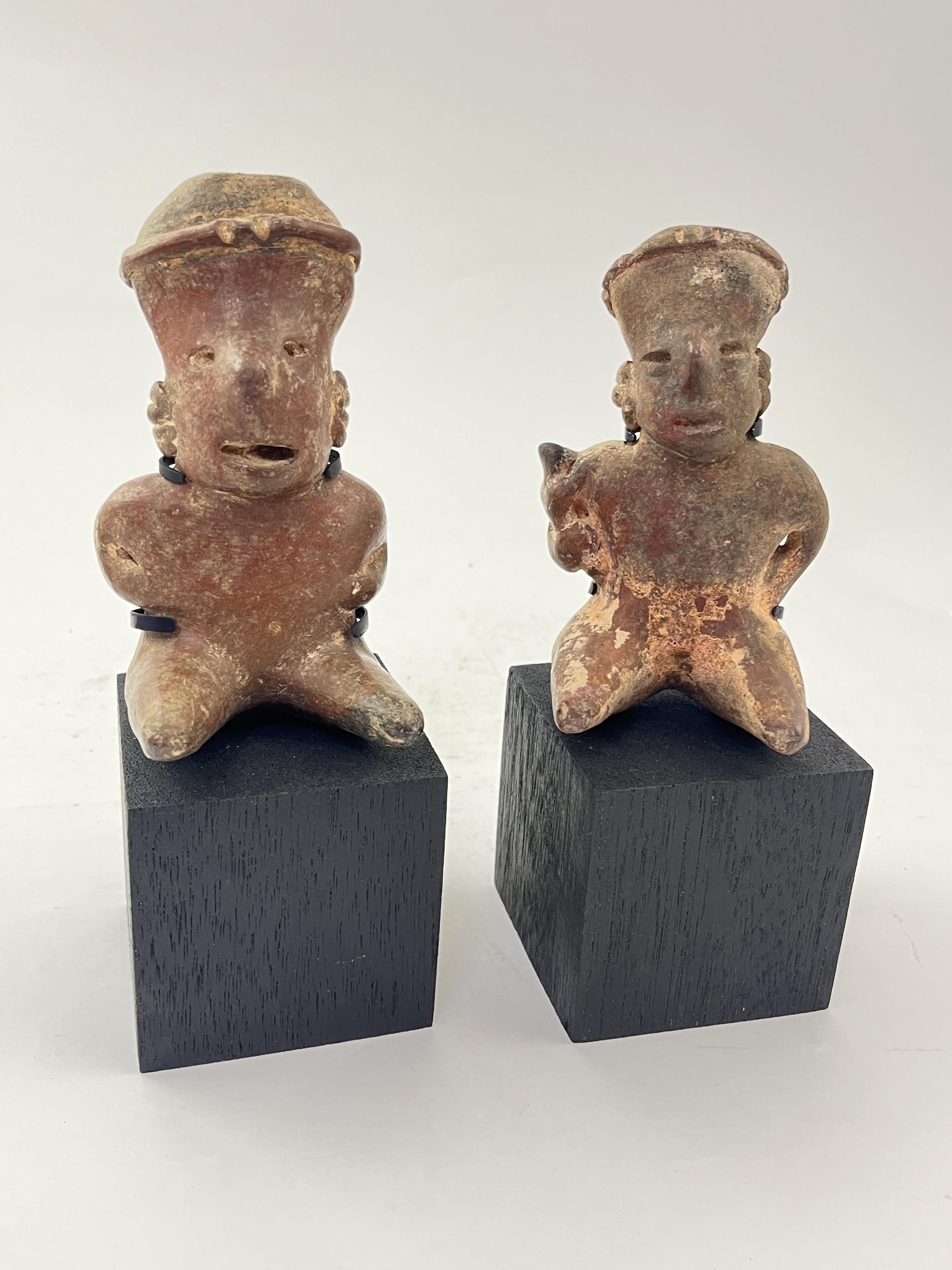 Two Pre-Columbian Nayarit polychrome seated figures, Western Mexico, 200 BC - AD 250